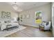 Bright and spacious main bedroom with a comfortable seating area and scenic outdoor views at 1826 Terry Mill Se Rd, Atlanta, GA 30316