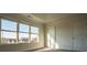 Bedroom with large windows providing natural light and a view of the outdoors at 1480 Baygreen Rd, Suwanee, GA 30024
