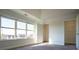 Bright bedroom featuring large windows and a walk-in closet for ample storage at 1480 Baygreen Rd, Suwanee, GA 30024