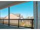 Outdoor deck featuring wooden flooring and railings with a view of the surrounding residential area at 1480 Baygreen Rd, Suwanee, GA 30024