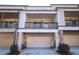Garage parking and covered balconies, showcasing modern townhome architecture and convenient outdoor living spaces at 1480 Baygreen Rd, Suwanee, GA 30024