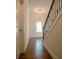 Bright hallway featuring hardwood floors, leading to the front door, filled with natural light at 1480 Baygreen Rd, Suwanee, GA 30024