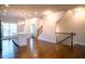 Open-concept living area with hardwood floors and a modern kitchen island with pendant lighting at 1480 Baygreen Rd, Suwanee, GA 30024