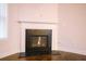 Classic fireplace with black hearth and a decorative white mantel in a well-lit living room at 1480 Baygreen Rd, Suwanee, GA 30024