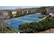 Several tennis courts surrounded by trees and lush landscaping offer a great recreation amenity at 1480 Baygreen Rd, Suwanee, GA 30024