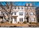 Charming townhouse exterior with brick and painted facade, enhanced by mature landscaping and abundant natural light at 1480 Baygreen Rd, Suwanee, GA 30024
