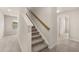 Carpeted staircase leading to the upper level, offering a clean and modern design at 1094 Georgian Point Dr Rd, Lawrenceville, GA 30045