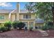 View of the home's backyard with patio and landscaped area, perfect for outdoor enjoyment at 146 River Ridge Ln, Roswell, GA 30075