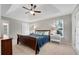 Comfortable bedroom features a vaulted ceiling, neutral tones, and an abundance of natural light at 146 River Ridge Ln, Roswell, GA 30075