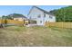 Spacious backyard with a patio, outdoor kitchen, and a newly seeded lawn at 1523 Grayson Pkwy, Grayson, GA 30017