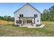 Backyard features a covered patio with an outdoor kitchen and a fenced yard at 1523 Grayson Pkwy, Grayson, GA 30017