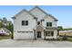 Stunning white brick home with a well-manicured lawn, a two-car garage, and a welcoming entryway at 1523 Grayson Pkwy, Grayson, GA 30017