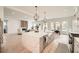 Open-concept kitchen with a large island, stainless steel appliances, and a view into the living room at 1523 Grayson Pkwy, Grayson, GA 30017