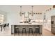 Bright and airy kitchen with a large center island, seating, and stainless steel appliances at 1523 Grayson Pkwy, Grayson, GA 30017