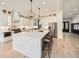 Modern kitchen featuring a large center island, quartz countertops, stainless steel appliances and custom cabinets at 1523 Grayson Pkwy, Grayson, GA 30017