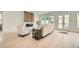 Bright living room featuring hardwood floors, a fireplace, and French doors to the backyard at 1523 Grayson Pkwy, Grayson, GA 30017