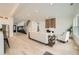 Open-concept living room with hardwood floors, a fireplace, staircase, and lots of natural light at 1523 Grayson Pkwy, Grayson, GA 30017