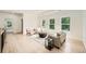 Relaxing living room boasts ample natural light, wood floors, and a modern design at 1523 Grayson Pkwy, Grayson, GA 30017
