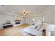 Large main bedroom featuring hardwood floors, a modern fireplace, and a tray ceiling at 1523 Grayson Pkwy, Grayson, GA 30017