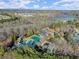 Community aerial view, showing pool and tennis courts, a lake, and residential development at 314 Mountain Laurel Walk, Canton, GA 30114