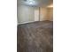 Spacious carpeted basement with neutral walls and lighting at 4100 Seneca Way, Stone Mountain, GA 30083