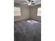 Sunlit bedroom featuring neutral walls, carpet, and multiple windows at 4100 Seneca Way, Stone Mountain, GA 30083