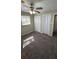 Bedroom features a ceiling fan, neutral paint, and soft carpeting at 4100 Seneca Way, Stone Mountain, GA 30083