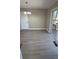 Well-lit dining area with sliding doors leading to the deck, enhanced by durable, modern, wood-look flooring at 4100 Seneca Way, Stone Mountain, GA 30083