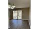 The dining area is open and bright, features a sliding glass door, and offers a seamless indoor-outdoor flow at 4100 Seneca Way, Stone Mountain, GA 30083