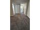 A hallway leads to rooms, featuring neutral carpeting, and white doors enhancing the sense of space and light at 4100 Seneca Way, Stone Mountain, GA 30083