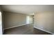 An expansive, sunlit living area featuring wood-look floors and neutral paint, ready for personalization at 4100 Seneca Way, Stone Mountain, GA 30083