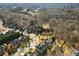 Aerial shot of a home nestled in a tree-filled suburban neighborhood at 485 Andelle Ave, Suwanee, GA 30024