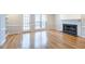 Cozy living room featuring hardwood floors and a classic fireplace with bookshelves at 5086 Stoneywood Se Cir, Mableton, GA 30126