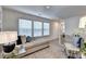 Bright bedroom featuring cozy chaise lounge, stylish accent chair, and neutral decor at 172 Ne Almand Ln, Conyers, GA 30013