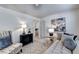 Bright bedroom featuring cozy chaise lounge, stylish accent chair, and neutral decor at 172 Ne Almand Ln, Conyers, GA 30013