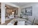 Light-filled dining room featuring modern table and stylish decor leading to the Living Room at 2700 Ne Almand Ln, Conyers, GA 30013