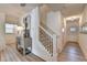 Inviting entryway with hardwood floors, a staircase, and a stylish console table with decor at 172 Ne Almand Ln, Conyers, GA 30013