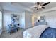 Spacious bedroom featuring tray ceilings, large windows and luxurious blue bedding at 2700 Ne Almand Ln, Conyers, GA 30013