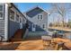 View of the home's backyard featuring a wooden deck perfect for outdoor entertaining at 2421 Pittman Cir, Cumming, GA 30040