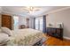 Bright bedroom featuring french doors and a decorative area rug at 2421 Pittman Cir, Cumming, GA 30040