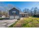 Charming two-story home featuring a well-manicured lawn, stone accents, and an attached two-car garage at 2421 Pittman Cir, Cumming, GA 30040