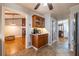 Kitchen with custom cabinetry and adjacent breakfast bar, offers access to other living areas at 2421 Pittman Cir, Cumming, GA 30040