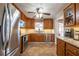 Well-equipped kitchen with oak cabinets, stainless steel appliances, and tiled backsplash at 2421 Pittman Cir, Cumming, GA 30040