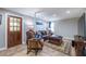 Cozy living room with neutral paint, hardwood floors, and an abundance of natural light at 2421 Pittman Cir, Cumming, GA 30040