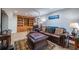 Inviting living room with hardwood floors, built-in shelving and comfortable seating at 2421 Pittman Cir, Cumming, GA 30040