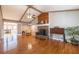 Bright living room with high ceilings, stone fireplace, hardwood floors and natural light at 2421 Pittman Cir, Cumming, GA 30040