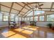 A spacious sunroom with lots of windows, hardwood floors and high vaulted ceilings at 2421 Pittman Cir, Cumming, GA 30040