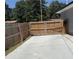 Backyard featuring a fenced gate with automated gate opener and concrete slab at 471 Tipton Dr, Riverdale, GA 30274