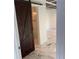 Modern barn door leading to marble bathroom with marble floors and walls at 471 Tipton Dr, Riverdale, GA 30274