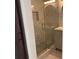 Elegant glass enclosed shower with gray pebble floor and marble surround at 471 Tipton Dr, Riverdale, GA 30274